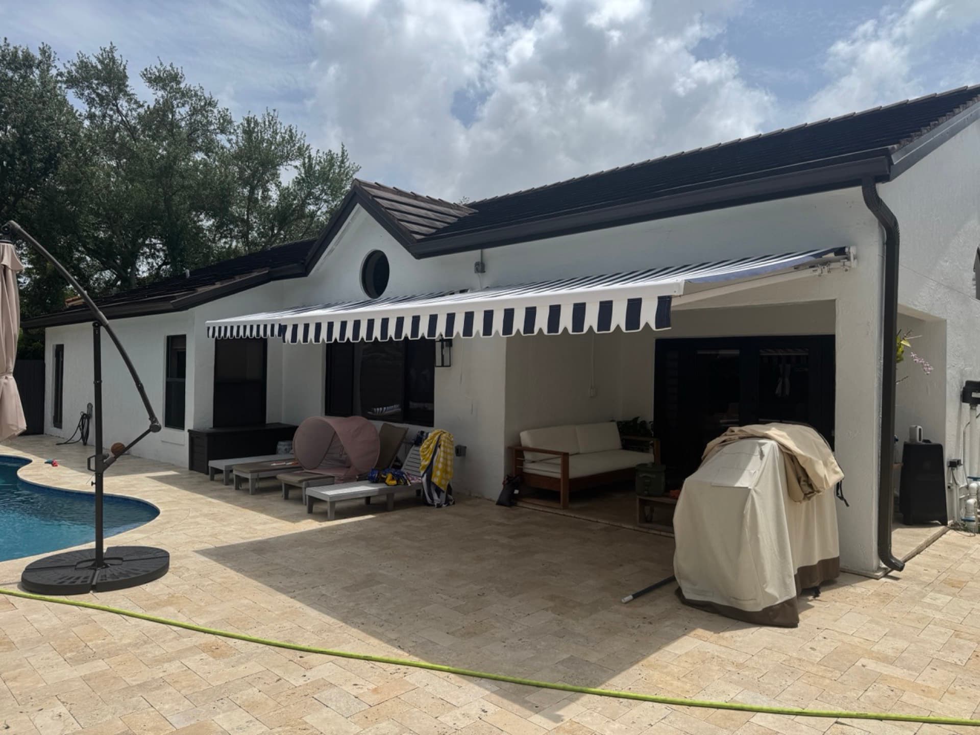 Motorized garage screen installed on a Florida garage